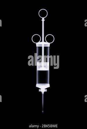 Medical syringe, X-ray. Stock Photo