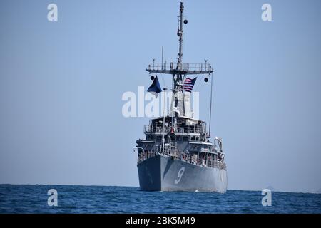 KOREA STRAIT (April 5, 2020) Avenger-class mine countermeasure ships USS Pioneer (MCM 9) conducts mine hunting training. Pioneer, Chief and Helicopter Mine Countermeasures Squadron 14, all part of Mine Countermeasures Squadron 7, are operating in the 7th Fleet area of operations to enhance interoperability with partners and serve as a ready-response platform for contingency operations. (U.S. Navy photo by Information Systems Technician 2nd Class James Greeves) Stock Photo