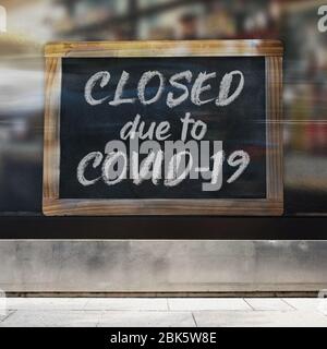 An illustrative image of business sign concept that says ‘Closed due to Covid-19’ on a store / restaurant window. Stock Photo