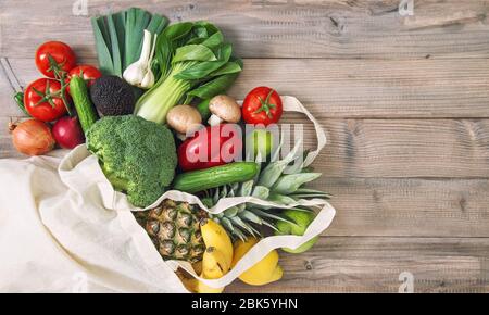 Fresh Avocado in eco bag for fruits and vegetables Stock Photo - Alamy