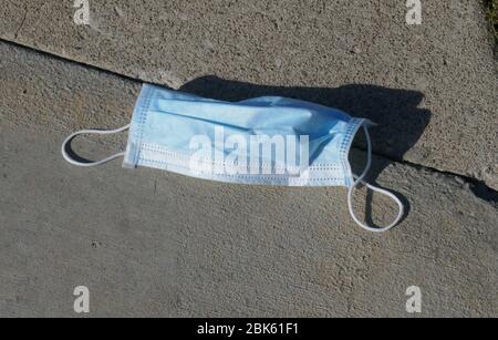 Beverly Hills, California, USA 1st May 2020 A general view of atmosphere discarded face mask on street during outbreak of Coronavirus Covid -19 pandemic and people practice social distancing during Stay At Home order on May 1, 2020 in Beverly Hills, California, USA. Photo by Barry King/Alamy Stock Photo Stock Photo