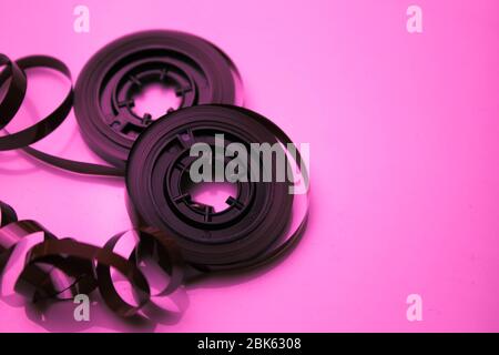 Disassembled audio cassette. Tangled cassette tape in knots. Old musical equipment. Stock Photo