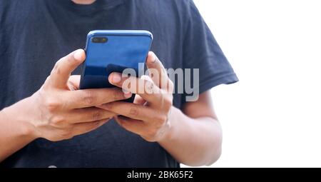 Young Indian man using smartphone Stock Photo