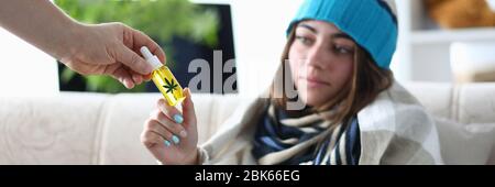 Unhealthy woman using cbd oil Stock Photo