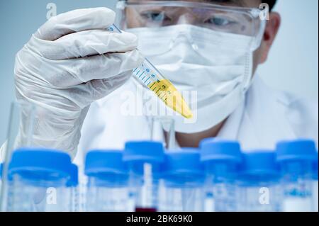 Asian male researcher working in the laboratory. Stock Photo