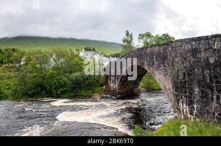 The bridge of orchy in Argyll and Bute with the river orchy in the central highlands of Scotland, United Kingdom Stock Photo