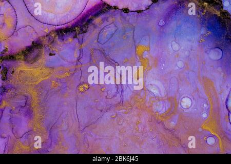 Alcohol Ink Artwork. Deep blue, purple and gold abstract background. Alcohol Ink Design. Modern contemporary art. Trendy wallpaper. Hand painted ink t Stock Photo