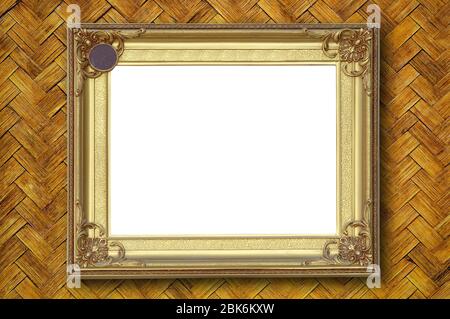 Gold picture frame on weave bamboo wall Stock Photo