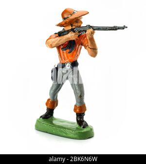Toy Cowboy aiming with his rifle Stock Photo