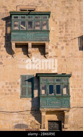 Balconies on a house in the capital city of Valletta, Malta. Stock Photo