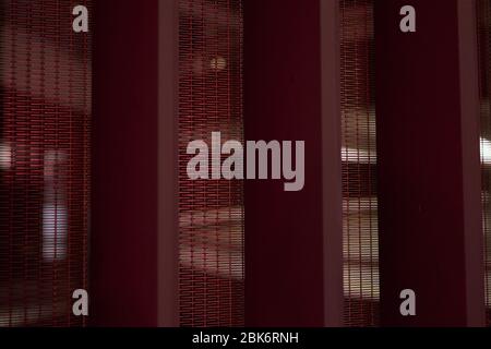 Red metal fence with meshed grating Stock Photo