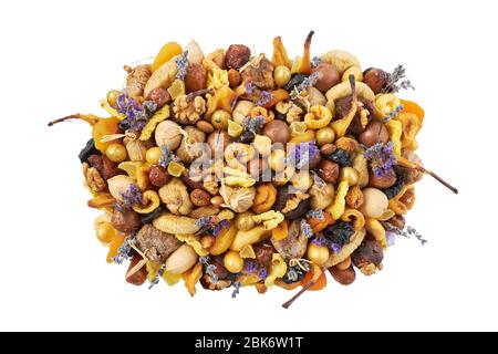 Large pile of different dried fruits and nuts isolated on a white background. Stock Photo