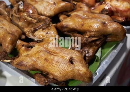 Thai cooked ducks are on the counter in the market. Stock Photo