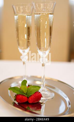 Two champaign glasses and strawberries isolated on white background Stock Photo