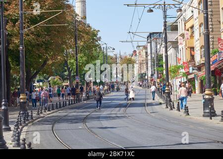 Istanbul, Turkey- September 20, 2017:Typical street in the city center, with tram tracks and numerous shops Stock Photo