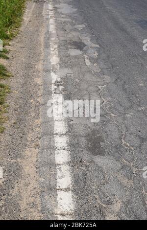 bad road damage of a German country road Stock Photo