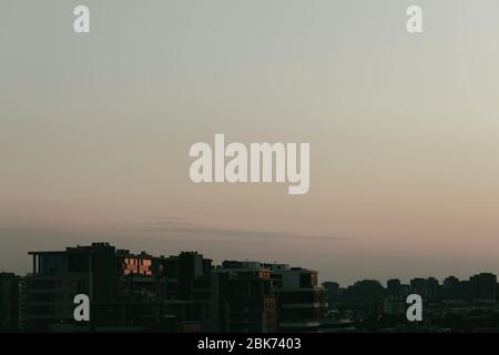 View of the cityscape in sunset light Stock Photo