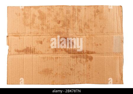 blank flat dirty sheet of yellow cardboard - mockup for homeless placard, isolated on white background Stock Photo