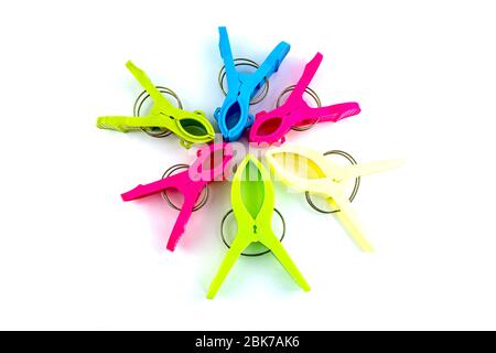 Colorful plastic clothespins on white background Stock Photo