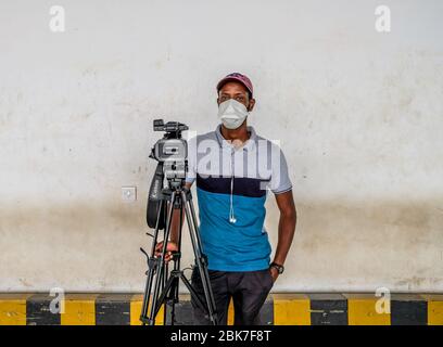 Beijing, Senegal. 20th Apr, 2020. Reporter Abdoulaye Dabo works at an airport in Dakar, Senegal, April 20, 2020. Many people have been sticking to their posts as the world fights against the COVID-19 epidemic. Credit: Eddy Peters/Xinhua/Alamy Live News Stock Photo