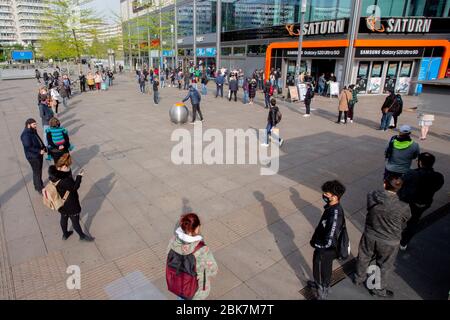 Berlin, Germany. 02nd May, 2020. People queue up in front of an electronics store on Alexanderplatz. Credit: Christoph Soeder/dpa/Alamy Live News Stock Photo