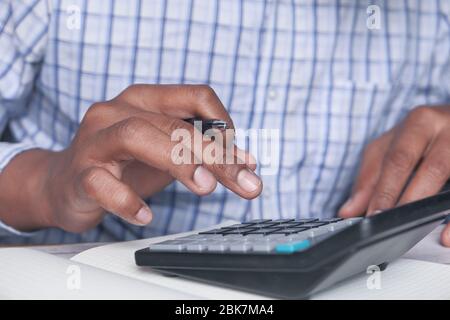 person hand using calculator on at offie desk. Stock Photo