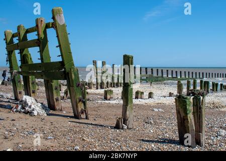 Battered wooden sea defences after winter storms on Climping Beach West Sussex. Stock Photo