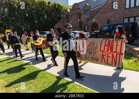 Los Angeles, USA. 01st May, 2020. A tenantÕs rights group marches to the Los Angeles MayorÕs mansion to demonstrate for renterÕs rights. Nearly half of L.A.Õs residents have been out of work due to the Covid-19 pandemic, with many having to choose to either buy food or pay rent. 5/1/2020 Los Angeles, CA. USA (Photo by Ted Soqui/SIPA USA) Credit: Sipa USA/Alamy Live News Stock Photo