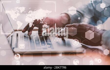 Unrecognizable african american man typing on laptop keyboard in office Stock Photo