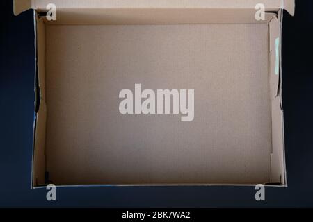 Empty brown box from under the shoes top view. An open cardboard box of a rectangular shape. Shopping for clothes and shoes on the Internet, home deli Stock Photo