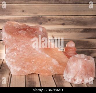 pink salt on a wooden table and backdrop lamp wellness Stock Photo