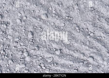 Dry soil background. Sand with stones as texture Stock Photo