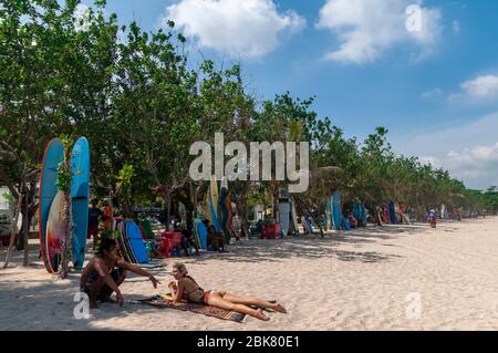 Surfers on Kuta Beach Bali Indonesia Stock Photo