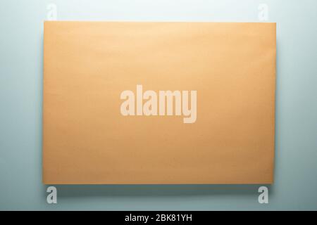 Yellow paper envelope with shadow. Paper texture. Stock Photo
