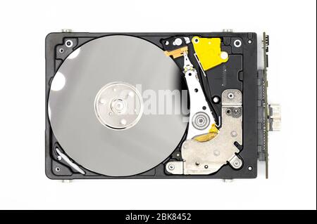 Disassambled Hard disk drive isolated on white background . Stock Photo