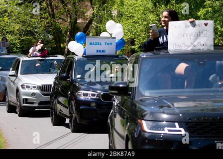 Potomac, United States. 02nd May, 2020. Friends line up to congratulates Sami Snow during a surprise drive-by Bat Mitzvah celebration in Potomac, Maryland on Saturday, May 2, 2020. The family held a small ceremony at the home with the Rabbi officiating online followed by a surprise drive by Mitzvah celebration due to the Coronavirus (COVID-19) social-distancing requirements. Photo by Kevin Dietsch/UPI Credit: UPI/Alamy Live News Stock Photo