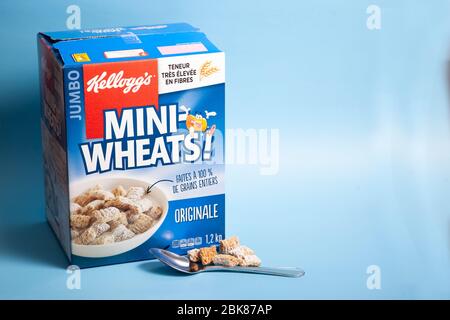 April 11, 2020 - Halifax, Canada: a huge box of delicious frosted Mini-Wheats cereal with a spoon Stock Photo