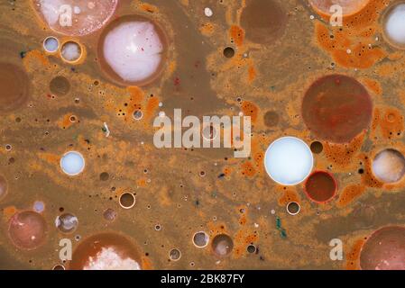 Brown liquid and mental circles. Mixed colors. Abstract natural background Stock Photo