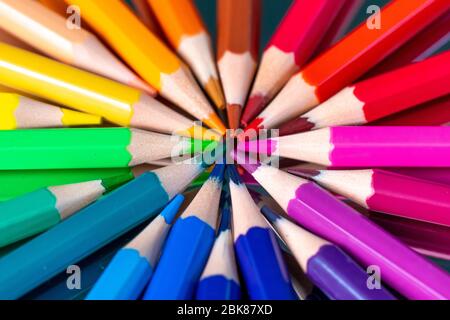 Many different colored pencils reflected on black background Stock Photo