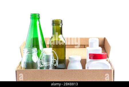 Glass garbage, plastic, aluminium in a box on white. Stock Photo