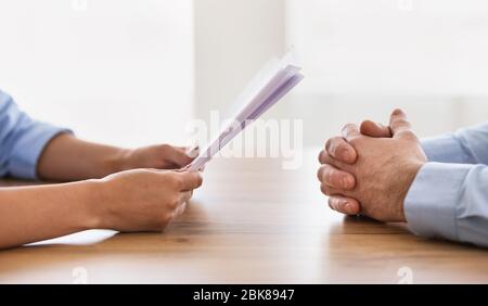 Unrecognizable HR-Manager Talking During Job Interview With Applicant In Office Stock Photo