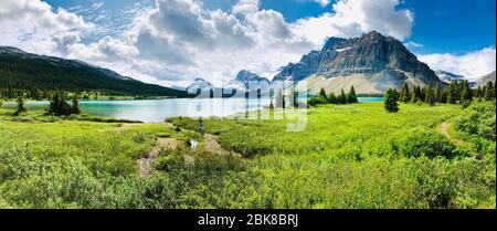 Beautiful Canadian Lake, Grass and Mountain Range - Pristine and Scenic Nature at Moraine Lake, Alberta Stock Photo