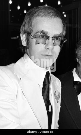 LONDON, UK. September 1974: pop star Elton John at the premiere of 'Gold' in London.  File photo © Paul Smith/Featureflash Stock Photo