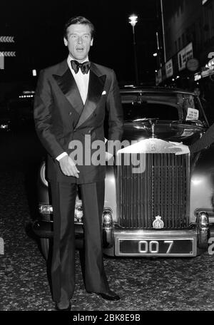 LONDON, UK. December 1974: Actor Roger Moore attends the premiere of his movie 'The Man with the Golden Gun' in London.  File photo © Paul Smith/Featureflash Stock Photo