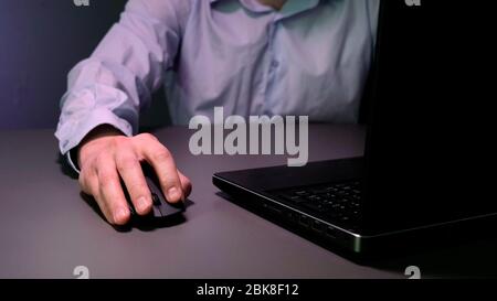 Hands of the Male Specialist working on Laptop Computer Stock Photo
