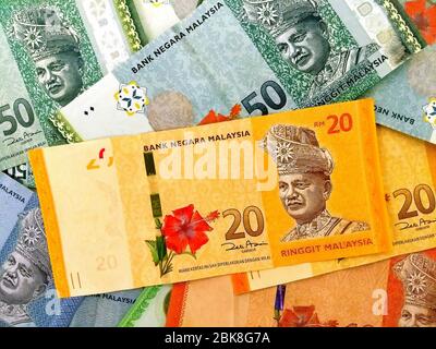 Currency of Malaysia, various multi-color paper Malaysian Ringgit banknotes, negotiable promissory notes Stock Photo