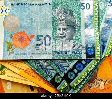Currency of Malaysia, various multi-color paper Malaysian Ringgit banknotes, negotiable promissory notes Stock Photo