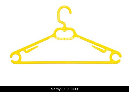 A yellow plastic coat hanger isolated on white background. Fashion retail concept Stock Photo