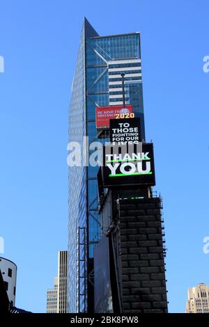 Billboards thanking essential workers in empty Times Square during coronavirus pandemic, New York City, May 1, 2020 Stock Photo