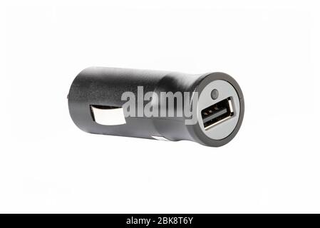 horizontal view of a black color car lighter charger with  usb socket isolated on white background Stock Photo